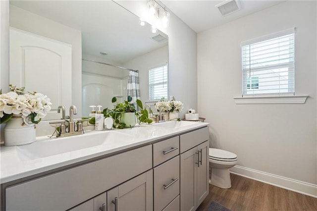 2860 Windsor Knoll Dr, Dacula, GA 30019 - bathroom featuring double vanity, wood finished floors, and a shower with curtain