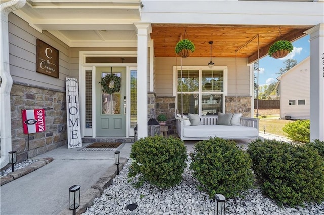 2860 Windsor Knoll Dr, Dacula, GA 30019 - property entrance with a porch and stone siding