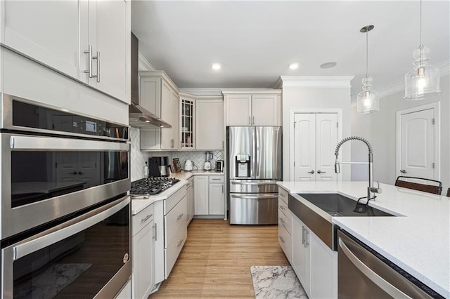2860 Windsor Knoll Dr, Dacula, GA 30019 - kitchen with stainless steel appliances, crown molding, light countertops, decorative light fixtures, and backsplash