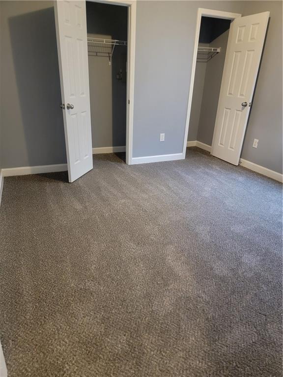 unfurnished bedroom featuring carpet