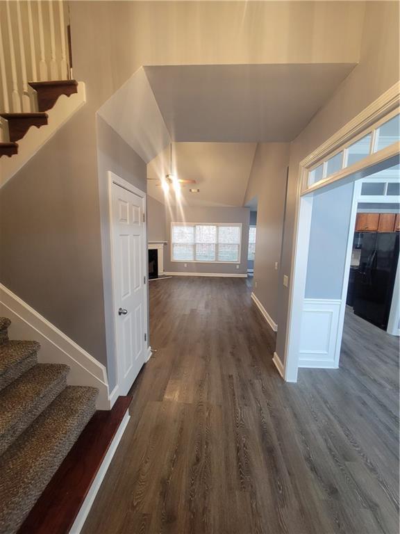 hall with dark wood-type flooring