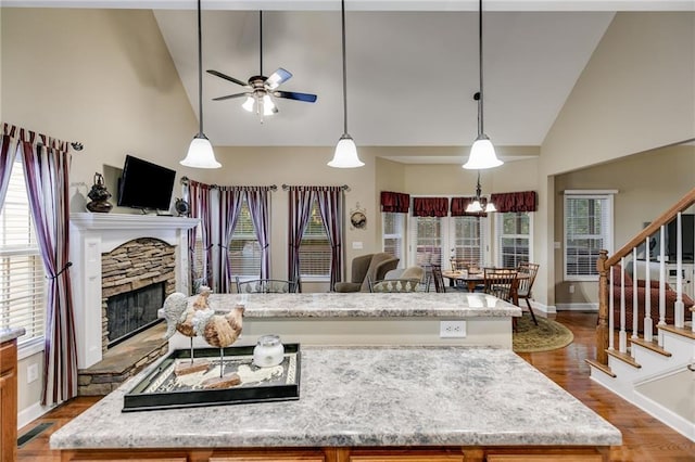 kitchen featuring light stone counters and sink