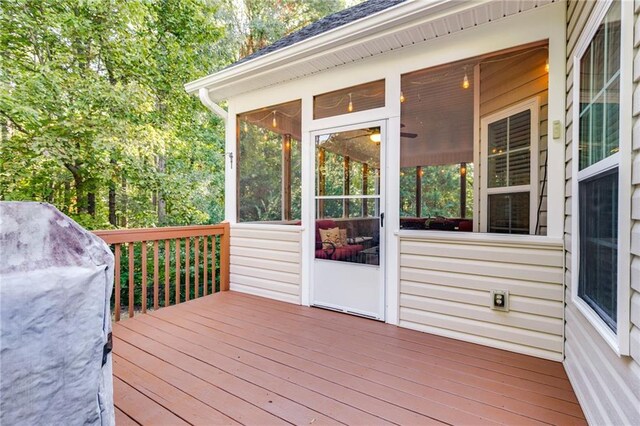 wooden terrace with a sunroom