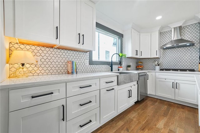 2357 Lynn Iris Dr, Decatur, GA 30032 - kitchen with a sink, white cabinetry, stainless steel dishwasher, wall chimney range hood, and dark wood-style flooring