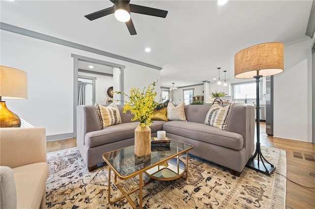 2357 Lynn Iris Dr, Decatur, GA 30032 - living room featuring crown molding, recessed lighting, visible vents, a ceiling fan, and wood finished floors