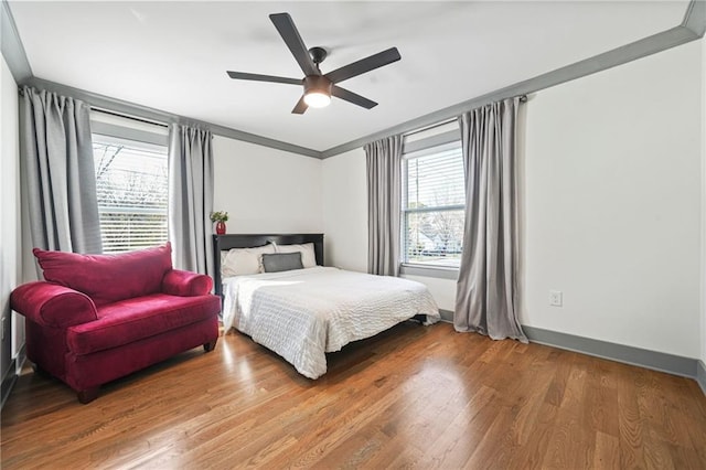 2357 Lynn Iris Dr, Decatur, GA 30032 - bedroom featuring multiple windows, wood finished floors, ceiling fan, and baseboards