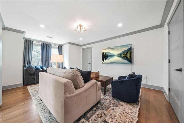 2357 Lynn Iris Dr, Decatur, GA 30032 - living area with wood finished floors, baseboards, visible vents, ornamental molding, and recessed lighting