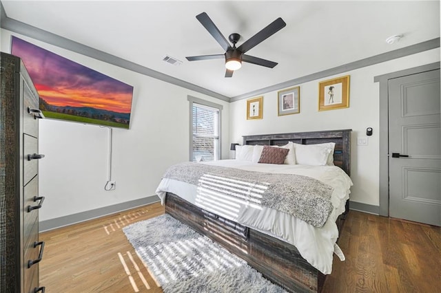 2357 Lynn Iris Dr, Decatur, GA 30032 - bedroom with wood finished floors, baseboards, ceiling fan, and visible vents