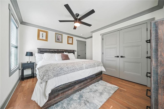 2357 Lynn Iris Dr, Decatur, GA 30032 - bedroom featuring ornamental molding, baseboards, a closet, and wood finished floors