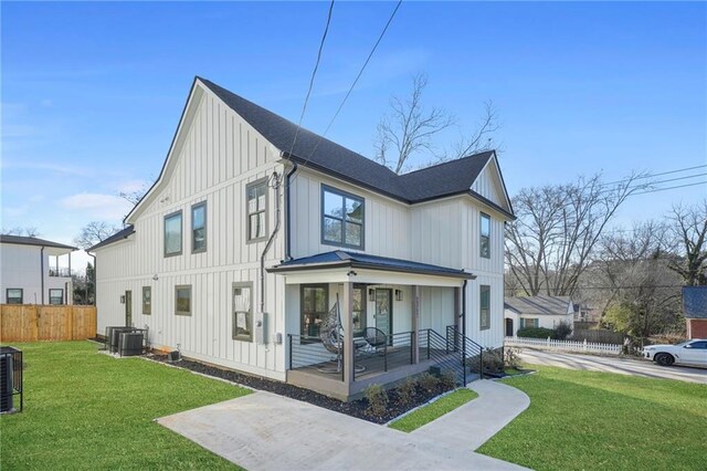 2357 Lynn Iris Dr, Decatur, GA 30032 - exterior space featuring central air condition unit, fence, board and batten siding, covered porch, and a yard