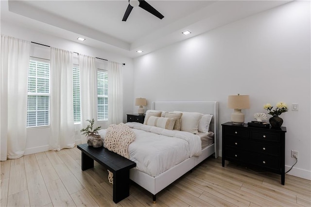 bedroom featuring recessed lighting, light wood-style flooring, baseboards, and ceiling fan