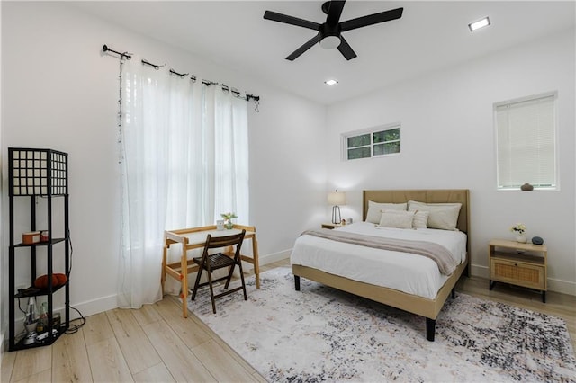 bedroom featuring recessed lighting, baseboards, and wood finished floors