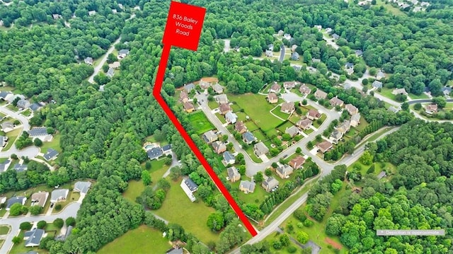 birds eye view of property with a residential view