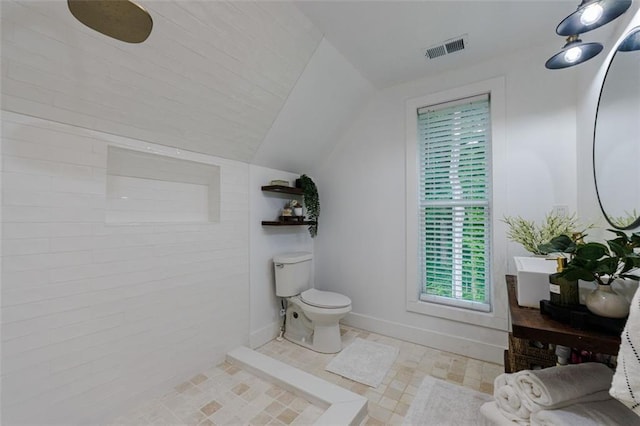 full bath featuring baseboards, visible vents, toilet, and lofted ceiling