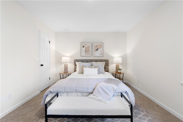 carpeted bedroom with baseboards