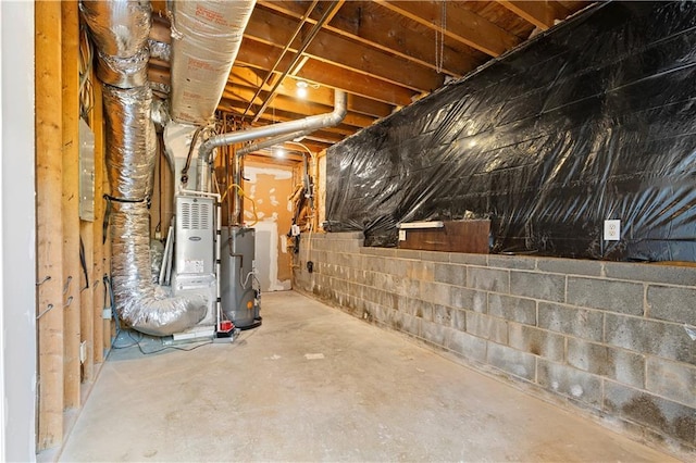 unfinished basement featuring water heater
