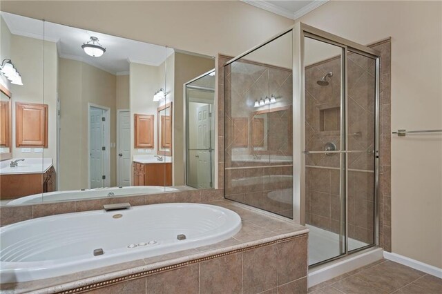 bathroom with plus walk in shower, ornamental molding, tile patterned floors, and vanity