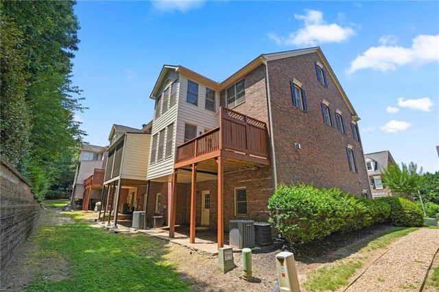 rear view of house featuring central AC and a patio area