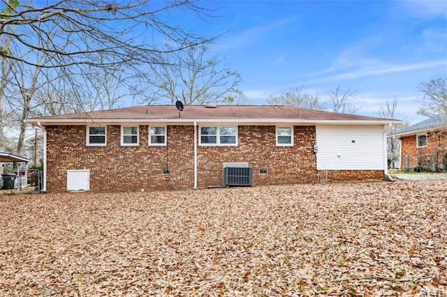 back of house featuring central AC