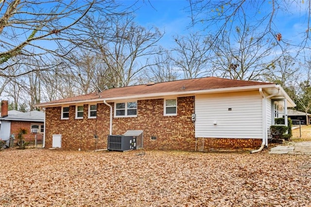 back of property with central AC unit