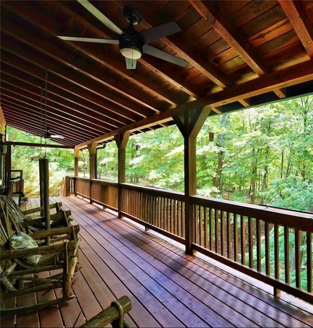 wooden terrace featuring ceiling fan