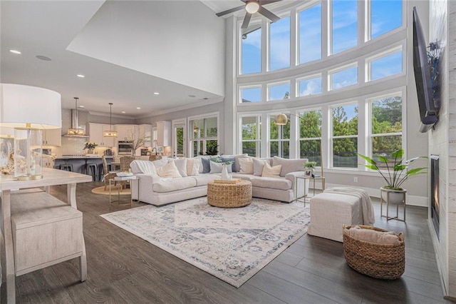 1865 Henley Way, Alpharetta, GA 30009 - living room featuring plenty of natural light, dark wood finished floors, a ceiling fan, recessed lighting, and a high ceiling