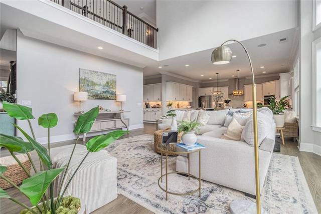 1865 Henley Way, Alpharetta, GA 30009 - living room with a high ceiling, light wood-type flooring, baseboards, and recessed lighting