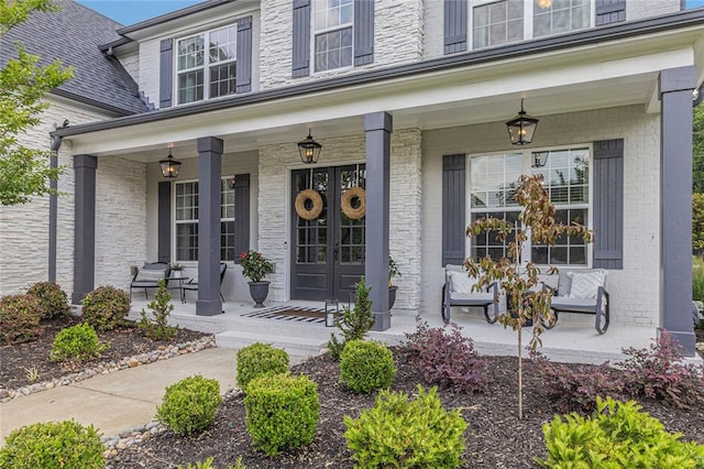 1865 Henley Way, Alpharetta, GA 30009 - view of exterior entry featuring a porch, brick siding, and french doors