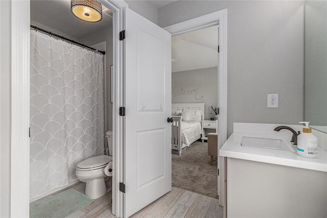 1865 Henley Way, Alpharetta, GA 30009 - ensuite bathroom with wood finished floors, toilet, and vanity