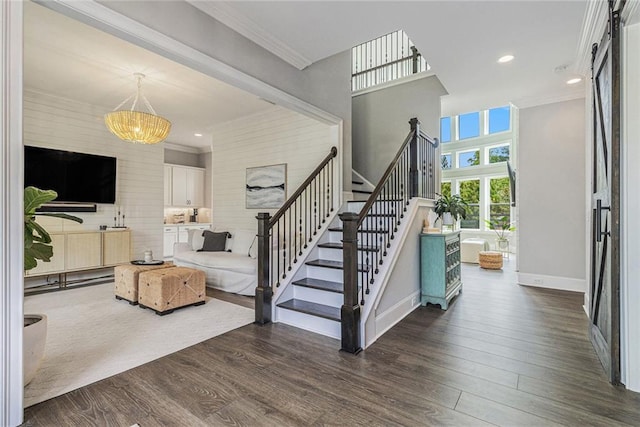 1865 Henley Way, Alpharetta, GA 30009 - stairs featuring wood finished floors, a chandelier, crown molding, baseboards, and recessed lighting