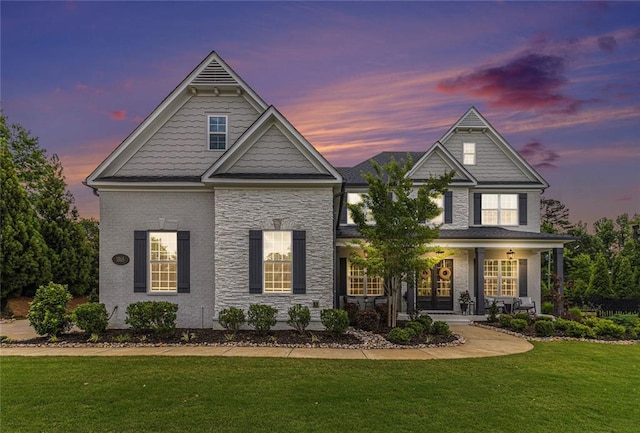 1865 Henley Way, Alpharetta, GA 30009 - view of front facade featuring covered porch, a front lawn, and stone siding