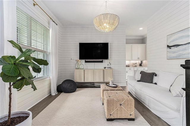 1865 Henley Way, Alpharetta, GA 30009 - living area featuring crown molding, a chandelier, wood finished floors, and wood walls