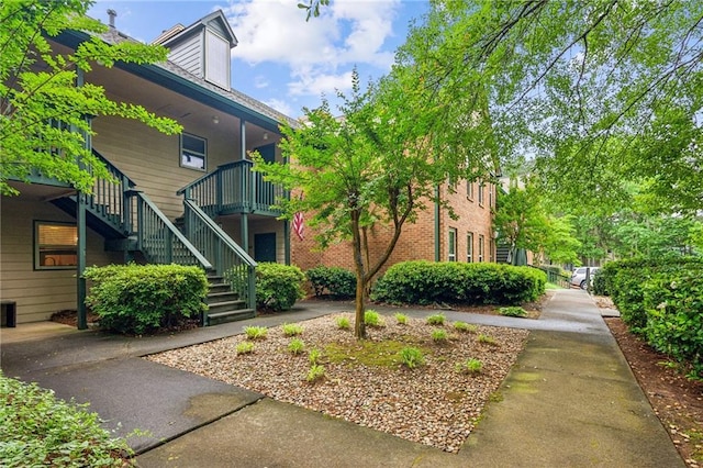 view of property featuring stairway