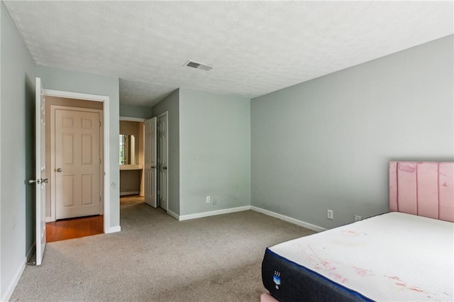 carpeted bedroom with baseboards