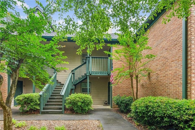 view of side of property with stairs