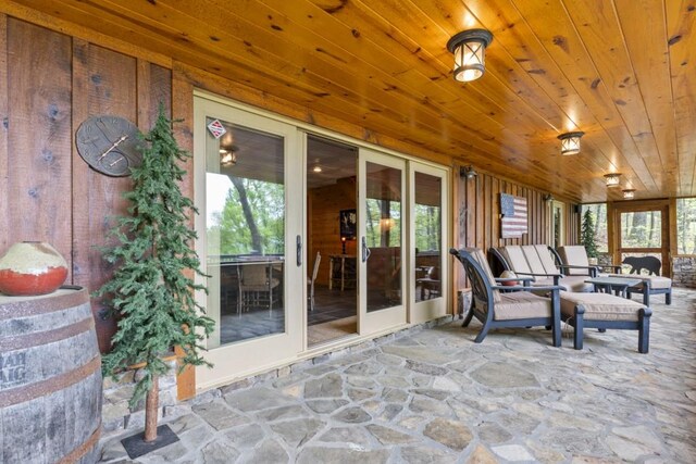 852 Black Bear Den Rd, Clayton, GA 30525 - dining room with wood ceiling, an inviting chandelier, beam ceiling, light wood finished floors, and wooden walls