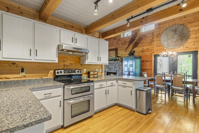 852 Black Bear Den Rd, Clayton, GA 30525 - laundry area with wooden walls, laundry area, and washing machine and dryer