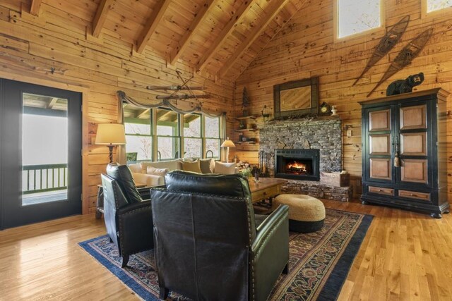 852 Black Bear Den Rd, Clayton, GA 30525 - living area with wooden walls, wood finished floors, and a fireplace