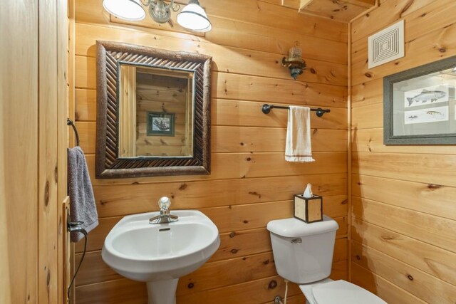 852 Black Bear Den Rd, Clayton, GA 30525 - bedroom featuring wooden walls, wood ceiling, beam ceiling, and hardwood / wood-style flooring