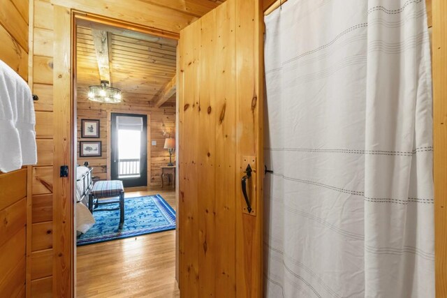 852 Black Bear Den Rd, Clayton, GA 30525 - stairs featuring wooden walls and wood finished floors