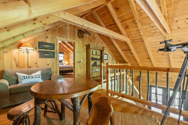 852 Black Bear Den Rd, Clayton, GA 30525 - bedroom featuring wood walls, vaulted ceiling with beams, and wood finished floors