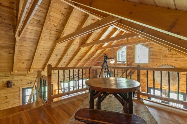 852 Black Bear Den Rd, Clayton, GA 30525 - bedroom with lofted ceiling with beams, light wood finished floors, wooden walls, and wooden ceiling