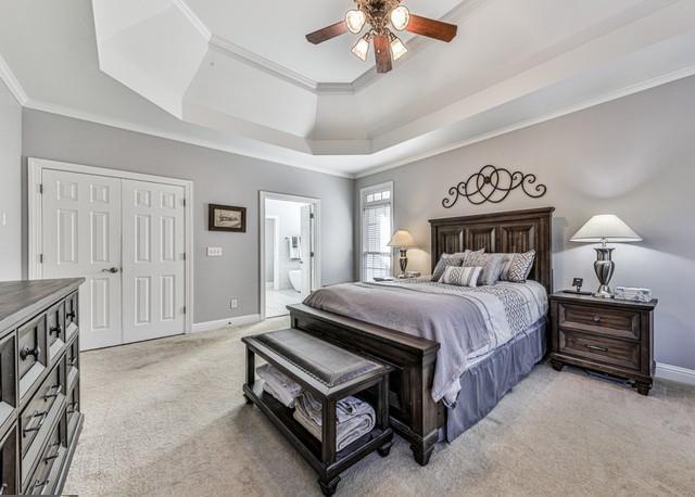 half bathroom with vanity, baseboards, and toilet