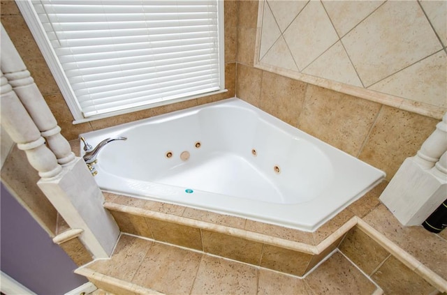 bathroom with tiled bath