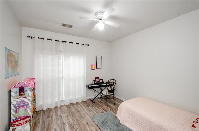 bedroom featuring ceiling fan and light hardwood / wood-style flooring