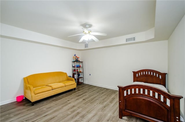 bedroom with ceiling fan and light wood-type flooring