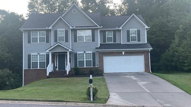 view of front facade featuring a garage and a front lawn