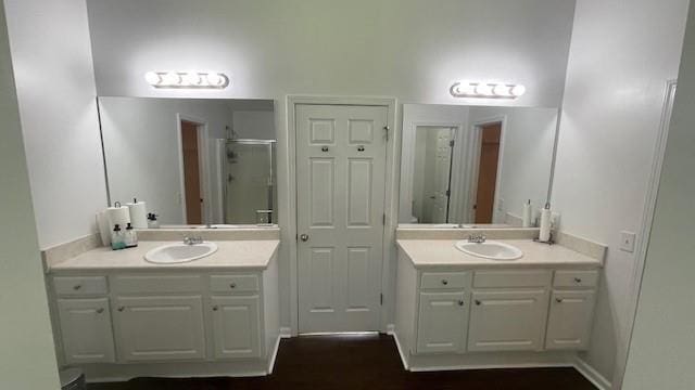 bathroom with vanity and an enclosed shower