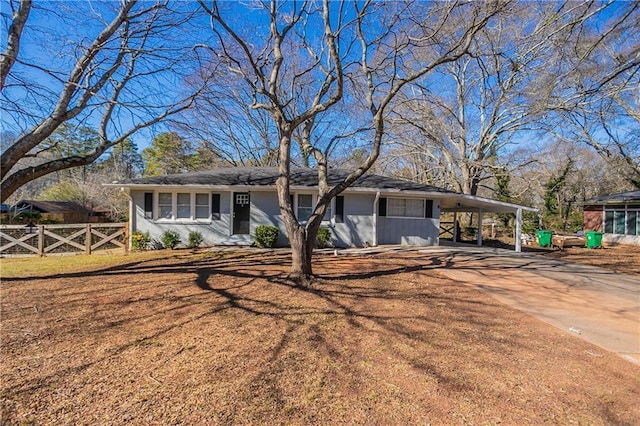 view of front facade with a carport