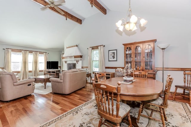 529 Arnold Rd, Lawrenceville, GA 30044 - dining room with a chandelier, wood finished floors, beamed ceiling, healthy amount of natural light, and a ceiling fan